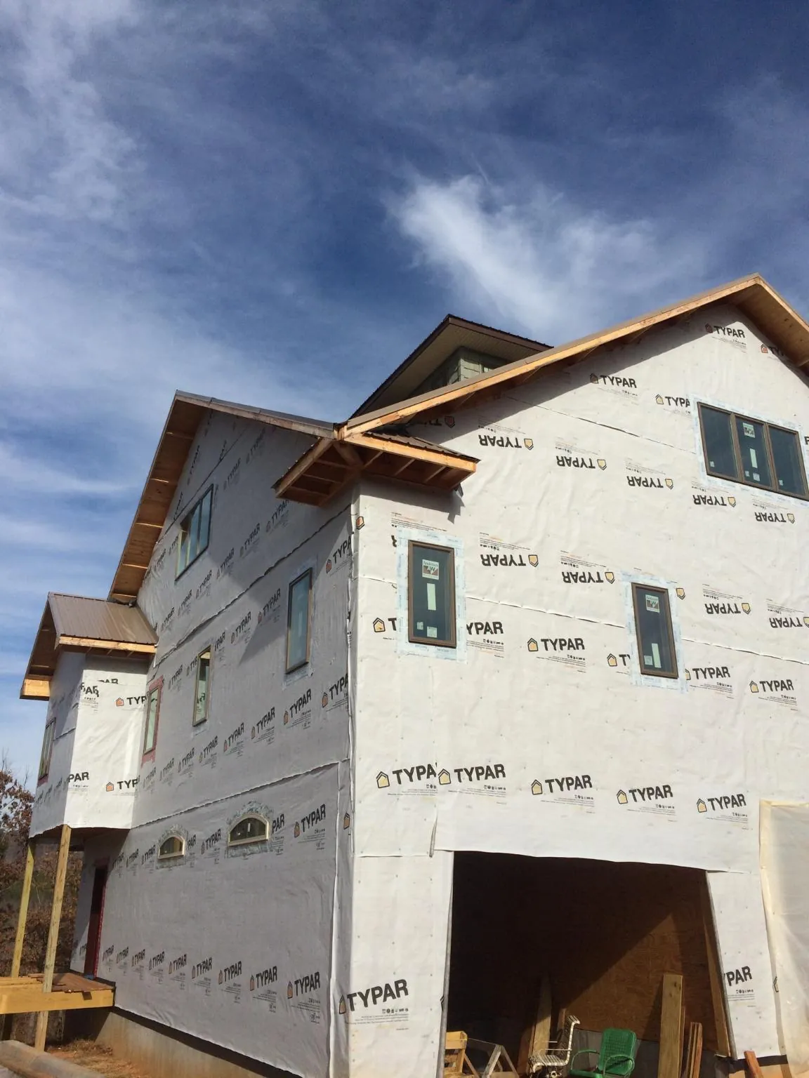 Stick built house wrapped in Typar with new roof framing and dormers in Graysville
